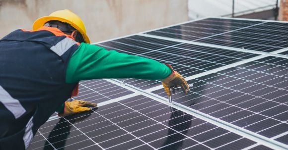 Innovative Sustainability - Solar Technician Installing Solar Panel